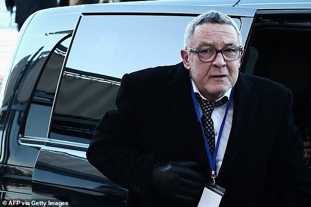 Nicolas attending his mother's funeral