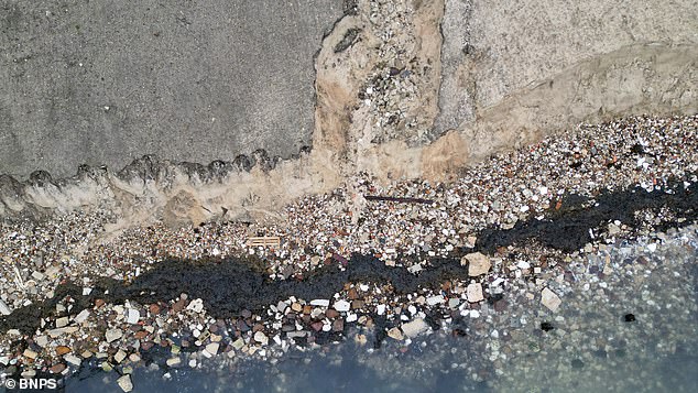 The policy has accelerated coastal erosion and exposed an old rubbish dump buried in the sandy bank