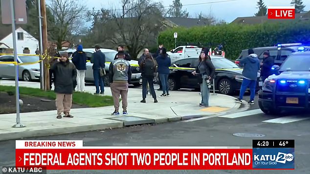 Crowds were seen gathering as authorities investigated the scene on Thursday