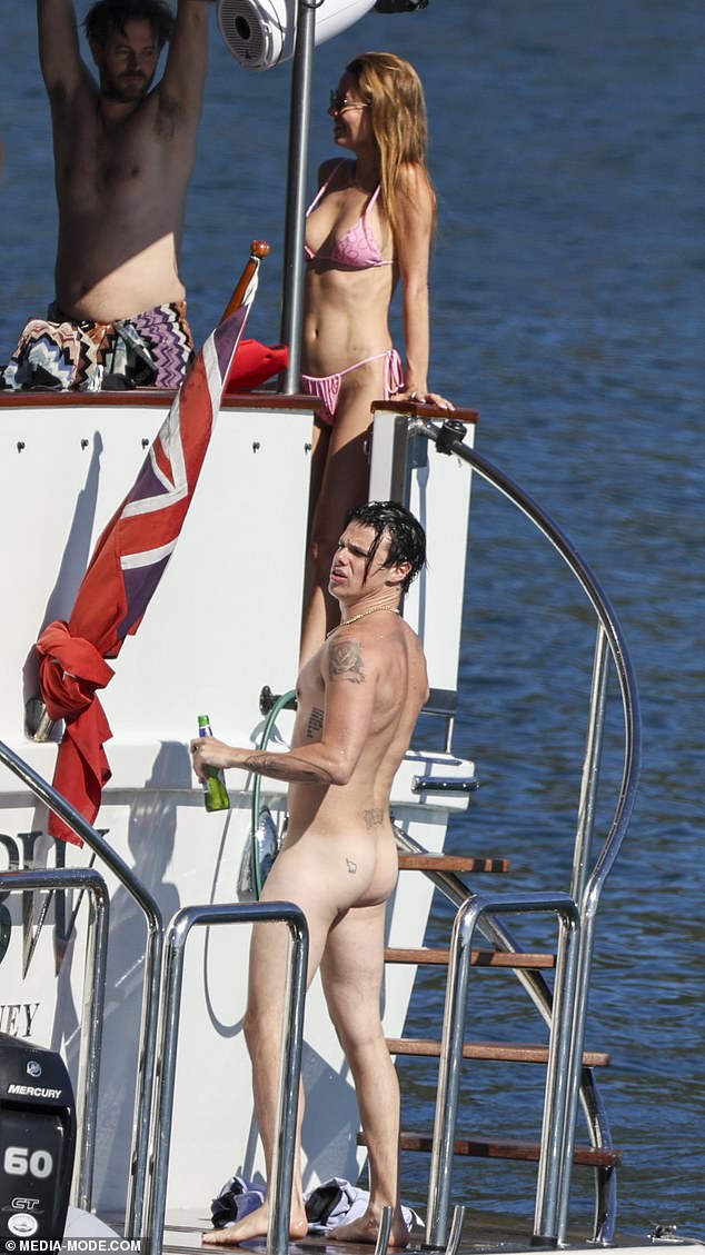 He was joined by socialite Dina Broadhurst, 50, who sported a tiny pink G-string bikini, as well as her on-off boyfriend, multimillionaire Winning Appliances heir John Winning Jr (top left)