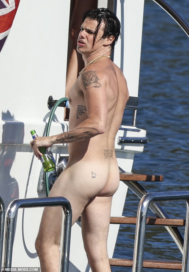 The artist left little to the imagination, making a half-hearted attempt at covering himself as he rose from the water