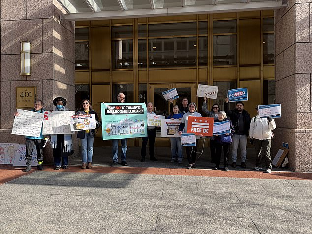 Outside about a dozen protesters gathered asking the National Capital Planning Commission to prevent the ballroom project from moving forward. 'Corruption never looks so tacky,' one of the demonstrator's signs said