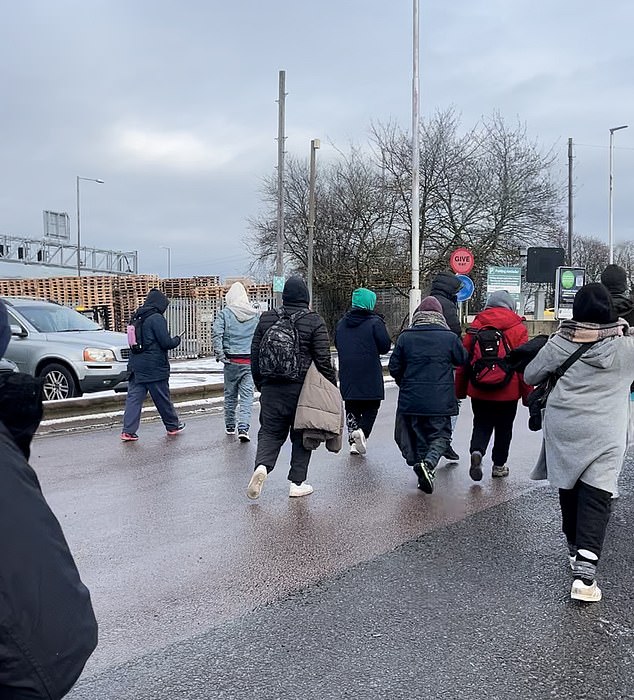 The video ends with the group walking towards the station exit towards the motorway