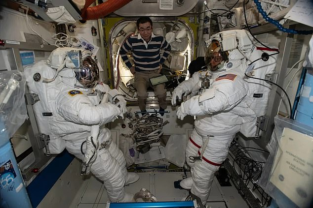 JAXA astronaut Kimiya Yui (center) was helping NASA astronaut Zena Cardman (left) and Mike Fincke prepare for the spacewalk before it was postponed