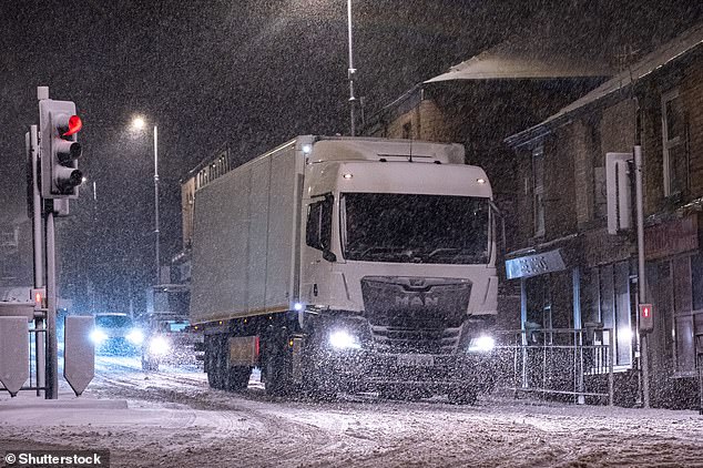A truck struggles at a road junction in the town of Mossley in Tameside, Greater Manchester