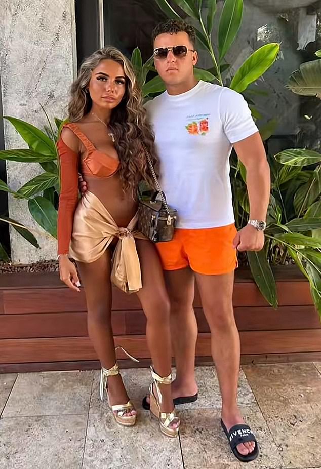 The couple seen in swimwear. Cook's sandals are believed to be Givenchy sliders that cost £295