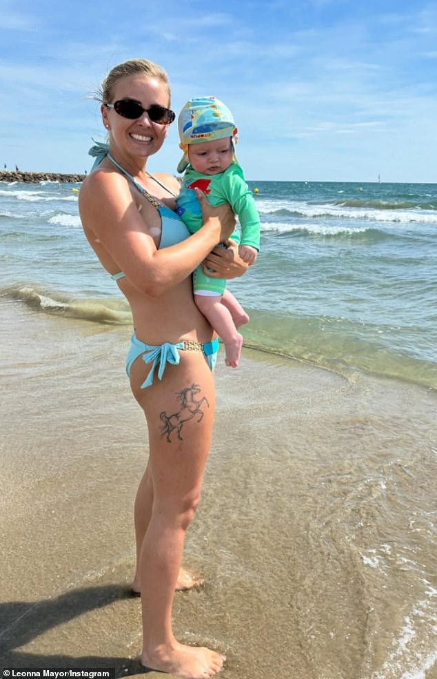 Leonna Mayor posted this photo of her on Instagram on a beach holding Teddy