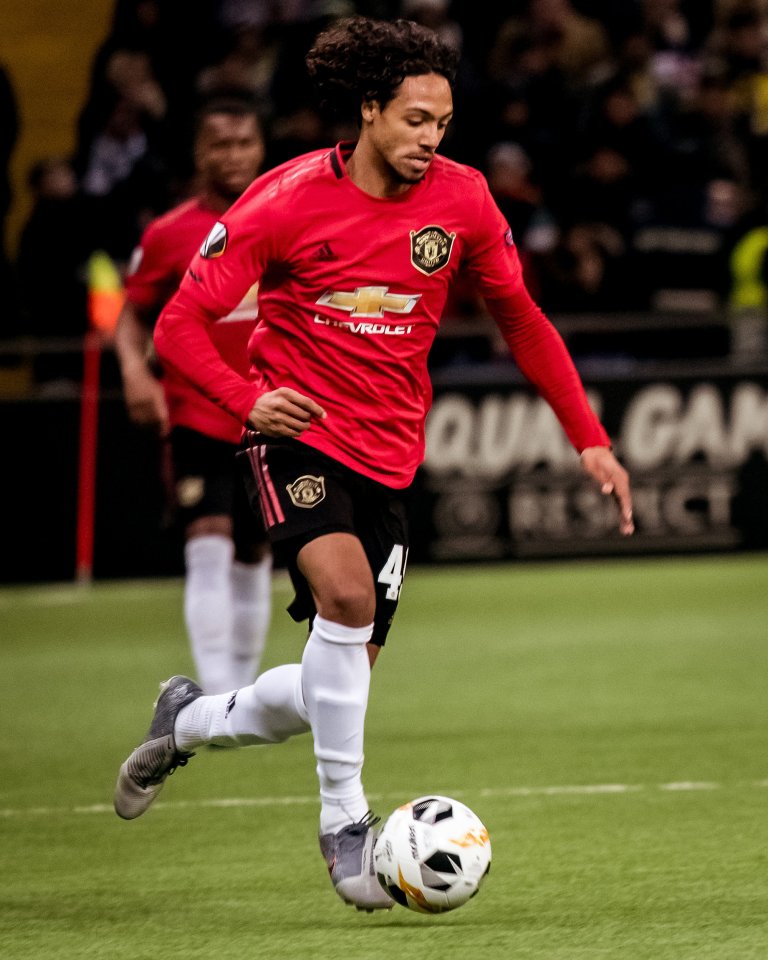 Ethan Laird playing for Manchester United during a UEFA Europa League match.