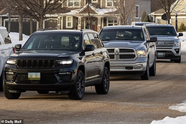 Once the belongings were loaded, the agents climbed into their unmarked trucks, forming a protective formation around a personal black Jeep SUV after it was driven out of the garage