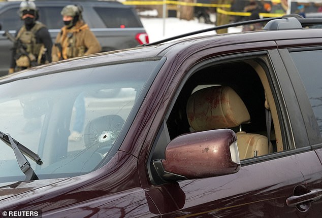 Bullet holes in Good's car windscreen and bloodied seats were clearly visible from the scene