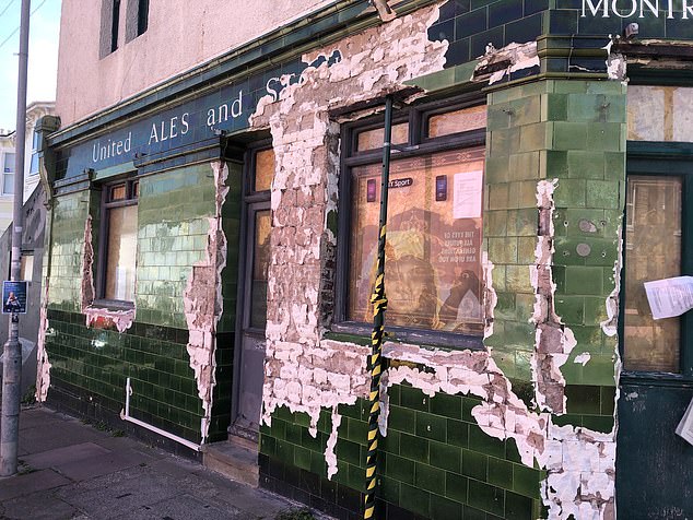 He employed a gang of builders to smash up historic tiles from the Montreal Arms in Brighton, pictured, in April 2022