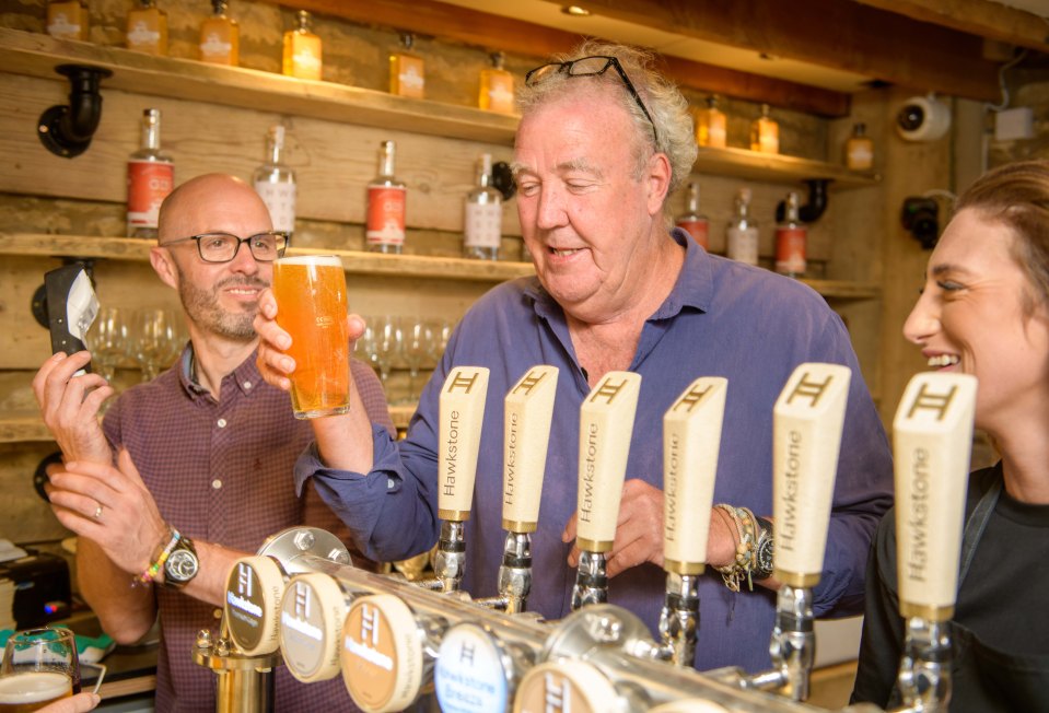 Jeremy Clarkson pouring a pint at his pub, The Farmer's Dog.