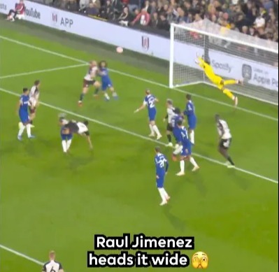 Soccer match with player Raul Jimenez heading the ball wide of the goal, score Fulham 0 - Chelsea 2.
