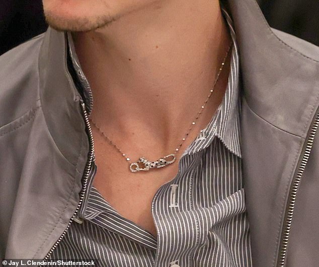 While seated at a table inside the Four Seasons Hotel, the star sported a silver Cartier necklace that is estimated to be worth around $36,000
