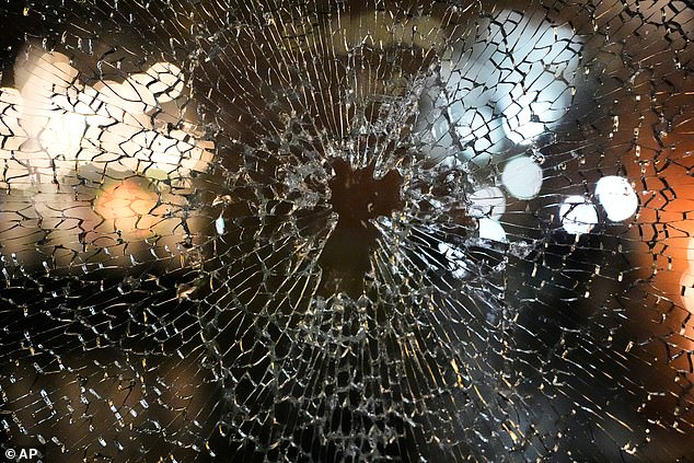 A window of the Residence Inn Minneapolis Downtown at The Depot hotel was broken after protesters broke in during a protest