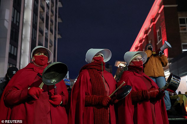 Protestors, many in masks, blew on horns, whistles and trumpets to make as much noise as possible. Police were nowhere to be seen