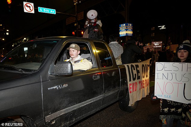 People were seen riding in the back of a truck during the protest outside the Canopy by Hilton hotel on Friday night