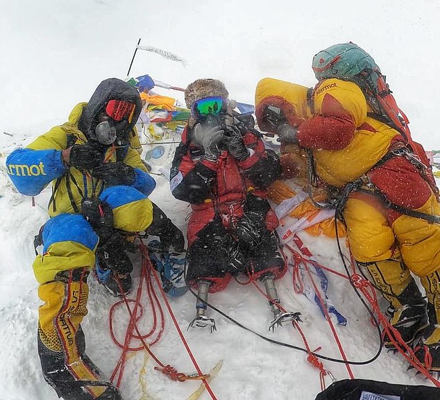 Mr Magar and two fellow climbers at the summit of Mount Everest, a feat that had been a childhood ambition of the former Gurkha