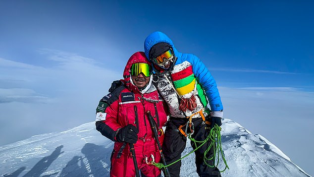 Mr Magar and a companion climber celebrate on the top of Denali, in Alaska in 2024