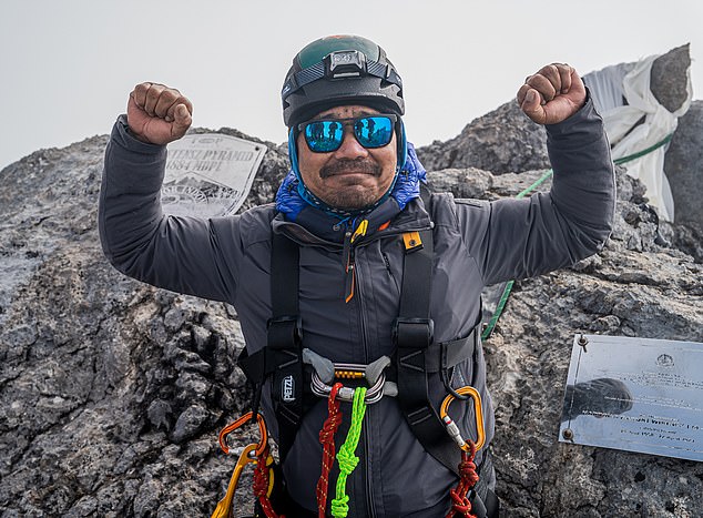 ... and months later he achieved his penultimate climbing challenge, reaching the summit of Puncak Jaya in Indonesia
