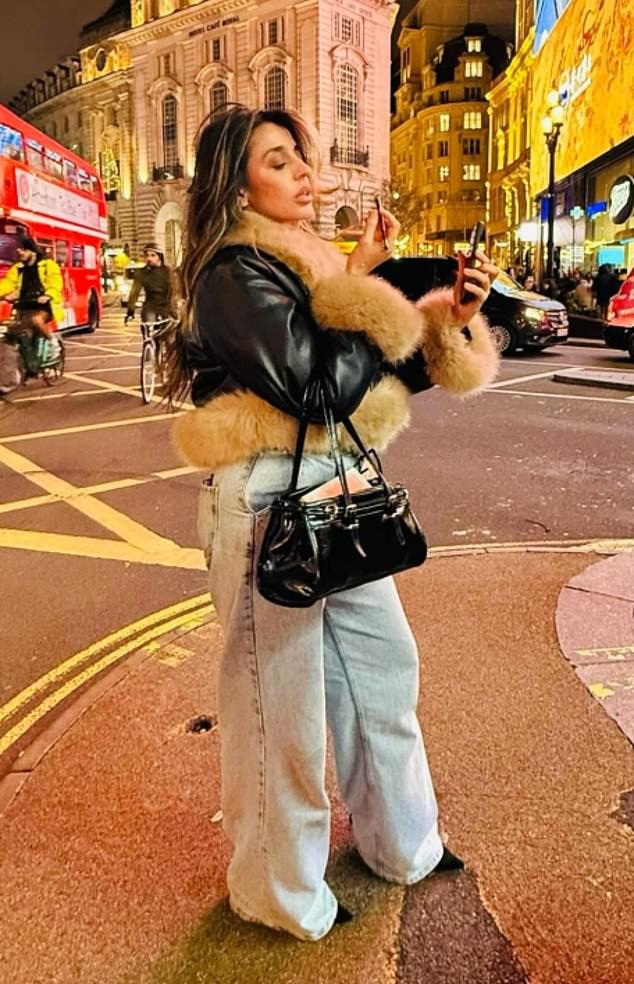 Shakil pictured applying lipstick in central London. She has also travelled to Paris, Rome and the Cotswolds