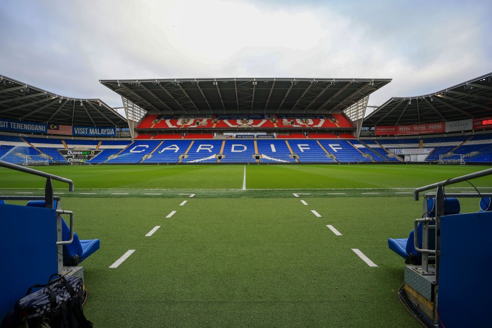 Cardiff City Stadium with empty blue and red seats spelling out "CARDIFF".