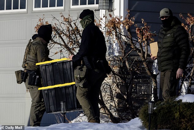 More agents from the fleet retrieved storage bins from the house - the Daily Mail counted five