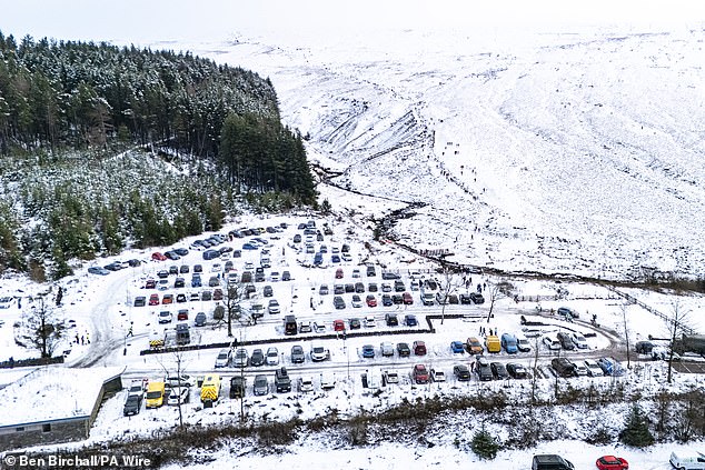 A full carpark at the base of Pen y Fan mountain during Storm Goretti