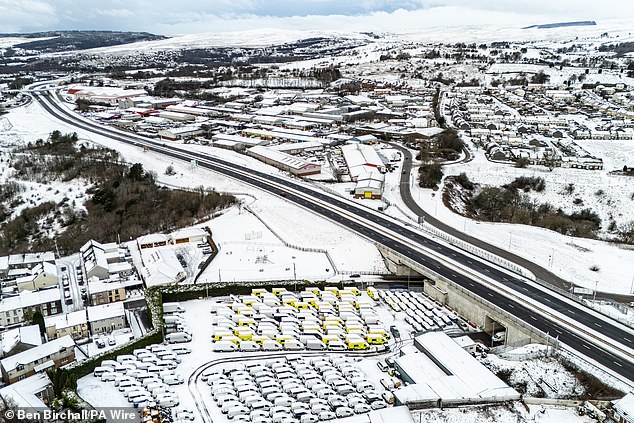 Snow settles around the A465 in the Dowlais area of Merthyr Tydfil in South Wales on Friday