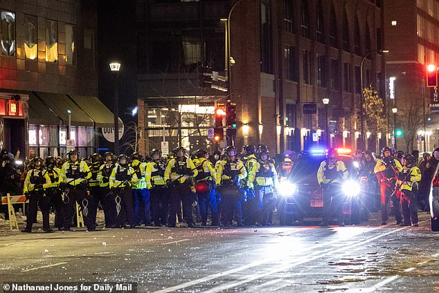 Lines of armed police officers are seen in downtown Minneapolis