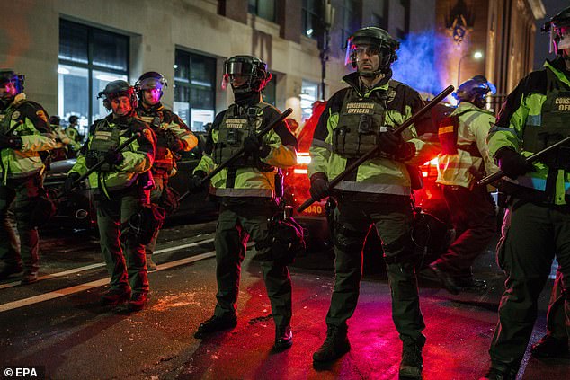 Dozens of armed Minnesota police officers are seen during a protest outside of one of the hotels where Immigration and Customs Enforcement (ICE) agents are thought to be staying in Minneapolis, Minnesota, USA, 09 January 2026
