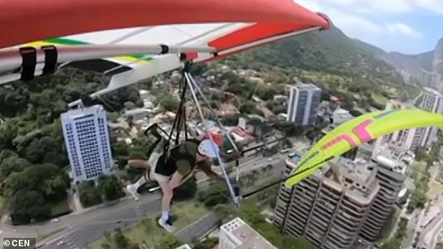 In footage, filmed by hang-glider Sergio Manoel Da Silva, the hang glider can be seen cruising above the skies of Rio when Philip's paraglider suddenly comes into view. Philip'swing then clips the bottom of the glider sending him spiralling to the ground below