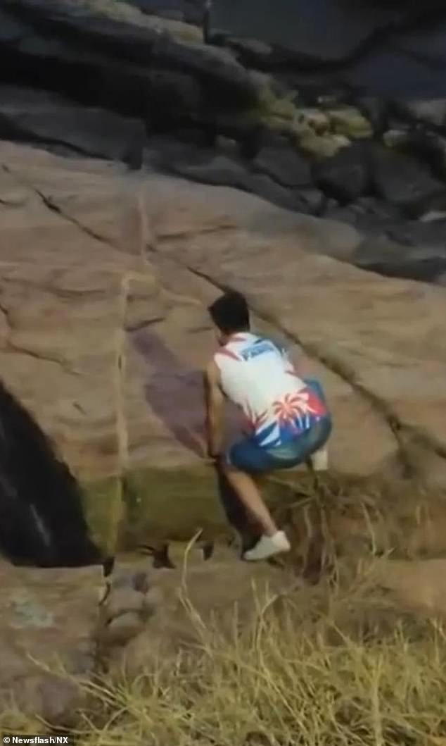 He attempted to climb down the steep rocks, but lost his footing, slipped, and struck his head, suffering fatal injuries in the fall