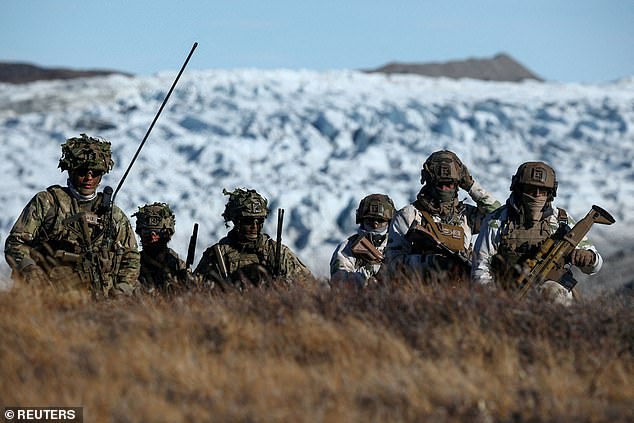 Members of the Danish armed forces practice looking for potential threats during a military drill on September 17, 2025