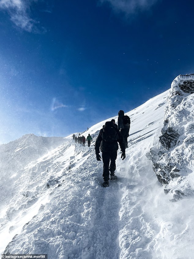 A trail of people make their way up Snowdon despite the Llanberis Mountain Rescue Team issuing an avalanche warning