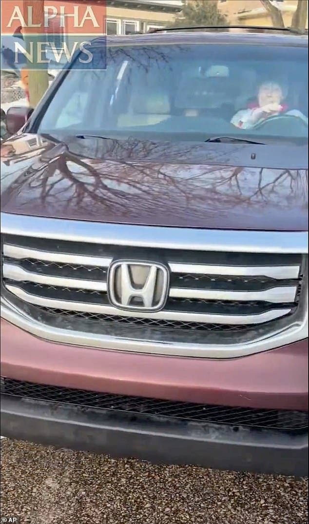 Pictured: The cellphone video from Ross the moment before he opens fire on Good, who is seen in the driver's seat