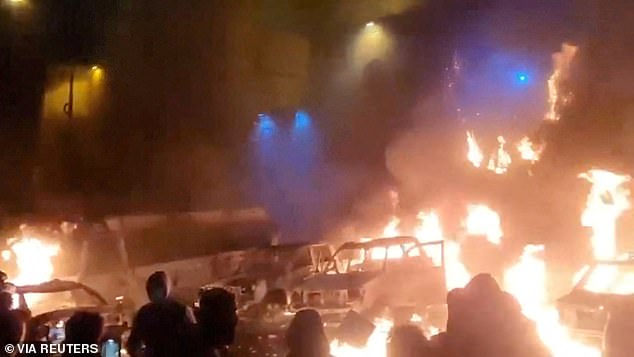 Protesters gather as vehicles burn, amid evolving anti-government unrest, in Tehran