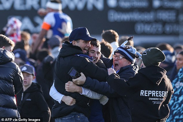 Ecstatic Macclesfield fans after they beat Palace yesterday. The supporters had queued in the cold outside Macclesfield FC's tiny ground for more than six hours to buy a ticket. Yet they would have happily done so for ten times longer