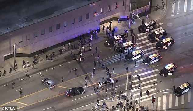 Officers formed lines of resistance using the patrol cars to create a barrier to protestors