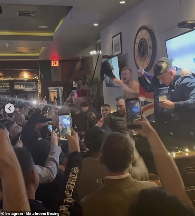 Smith (right) was also seen with his team leading chants of 'Walking in a Dalton wonderland'