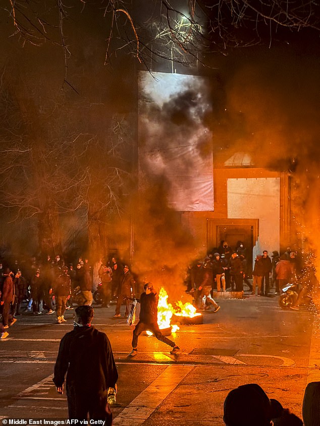 Iranians gather while blocking a street during a protest in Tehran, Iran on January 9, 2026