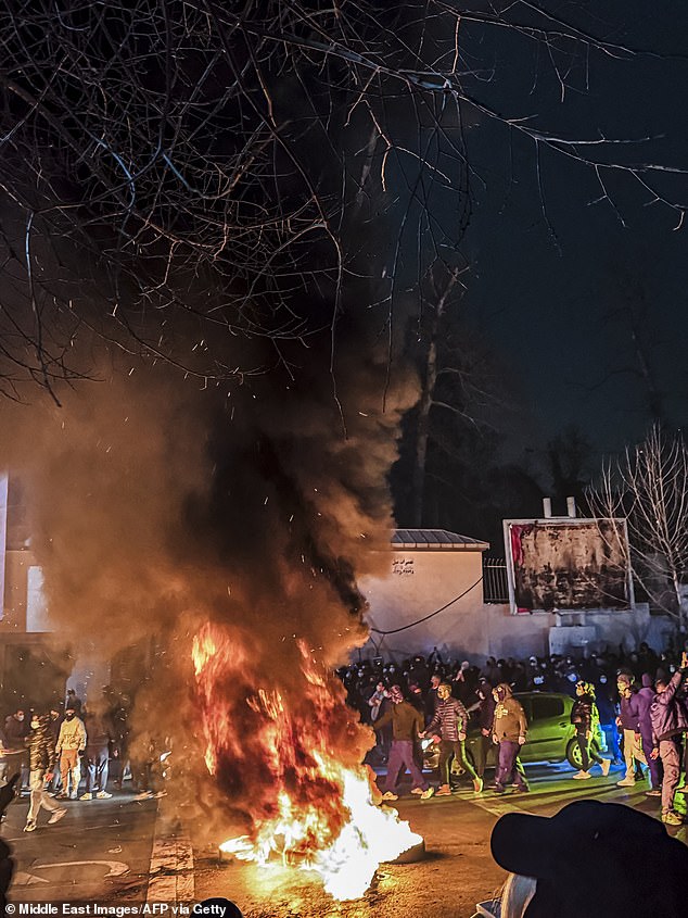 Iranians gather while blocking a street during a protest in Tehran, Iran on January 9, 2026