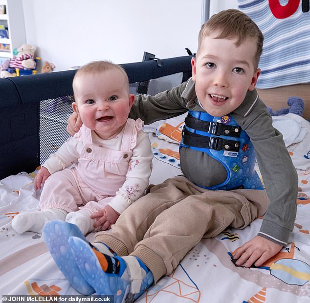 Ollie's diagnosis came when he was just 11 months old - his 7-month-old sister Bailey (left)  was born without the disease