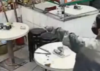 Moment woman brandishes 30cm kitchen knife after her payment failed