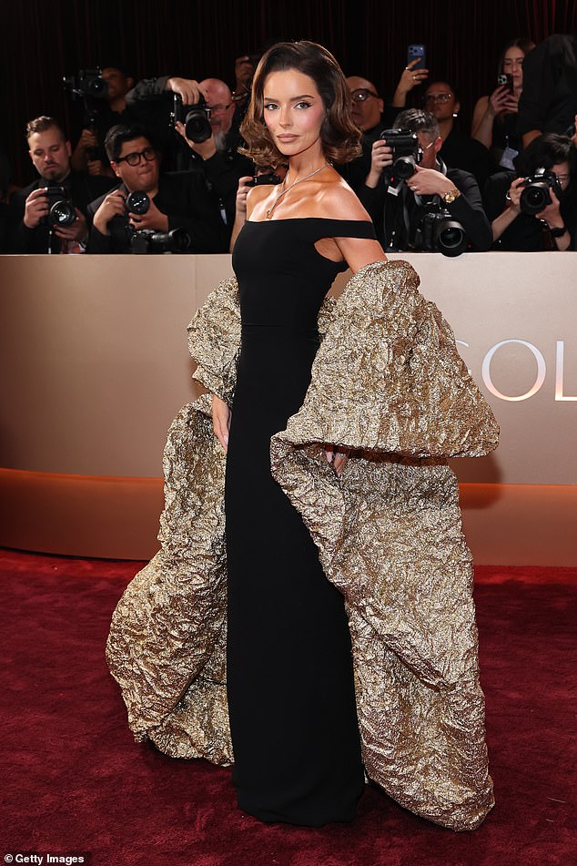 The Love Island star, 35, made sure to turn heads in the off the shoulder figure hugging dress as she posed on the star-studded red carpet at The Beverly Hilton