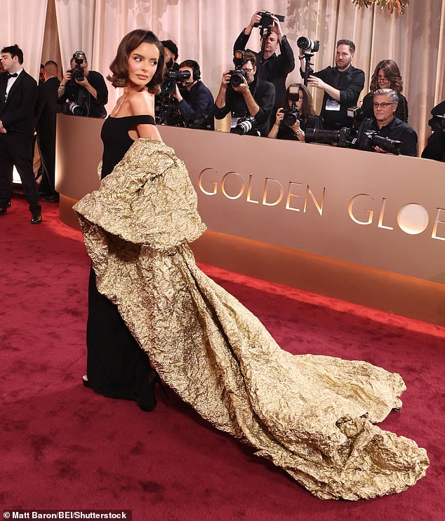 Maura elevated her frame in a pair of towering heels