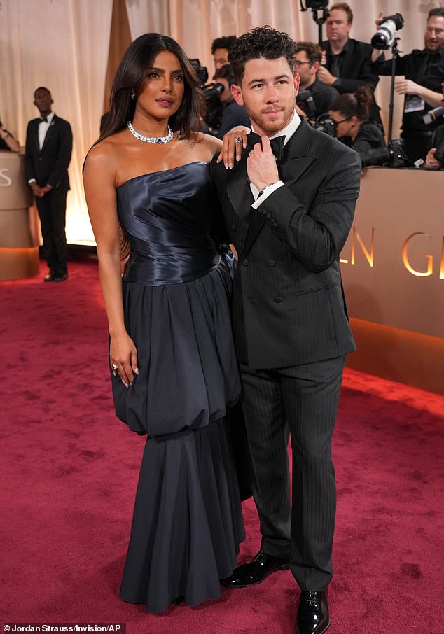 Priyanka Chopra-Jonas, left, and Nick Jonas arrive at the 83rd Golden Globes on Sunday, Jan. 11, 2026, at the Beverly Hilton in Beverly Hills, Calif. (Photo by Jordan Strauss/Invision/AP)