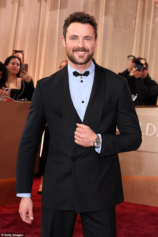 Efron, who recently appeared on Dancing With The Stars, accessorized with a silver watch