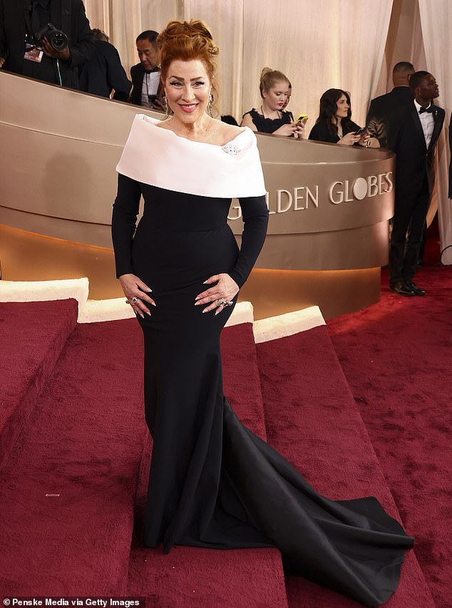 Playing it safe! Lisa Ann Walter wore a black, formfitting long sleeve gown with a mermaid-style hemline. The tuxedo-inspired dress featured a white, off-the-shoulder neckline, as she showed off her décolletage. She completed the look with some dramatic rings and her hair in a face-framing updo