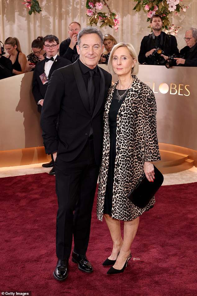 Jason Isaacs, 62, opted for an all black ensemble and was joined by his wife Emma Hewitt